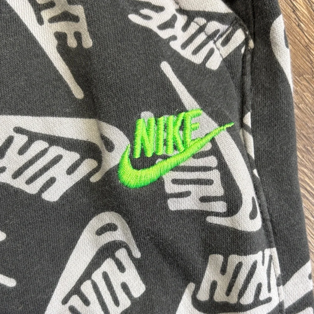 Nike Club Black Jogger Pants with White Logo Print and Neon Green Drawstring